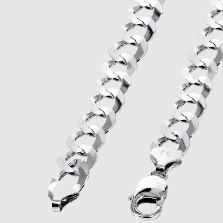 Close-up of the Curb Link Chain - 6mm-9.5mm Solid White Gold, featuring shiny, large interlocking curb links and a lobster clasp, set against a plain light background.
