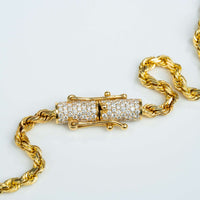 A close-up of the Rope Chain with Custom Diamond Lock - 4mm 14k Gold, featuring a cylindrical diamond-encrusted clasp, displayed on a white background.