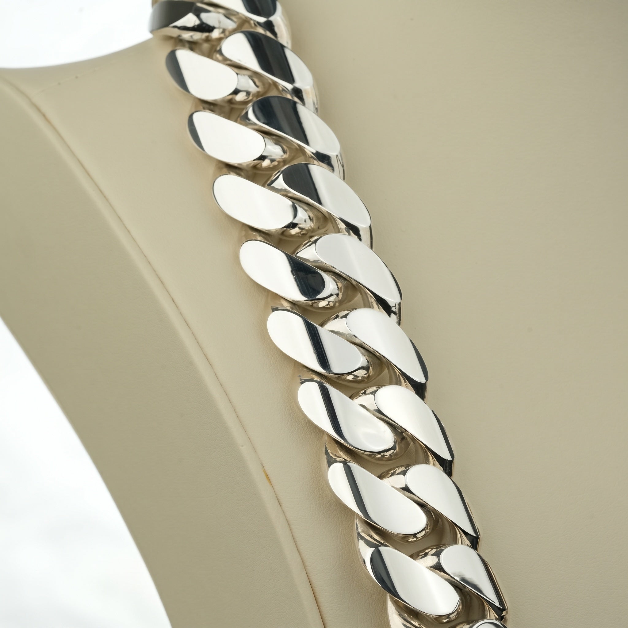 Macro detail of polished 950 silver Miami Cuban link links