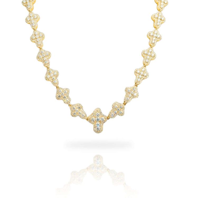 The Diamond Chain - Cross Shaped 10K 22" showcases repeating cross-shaped links, each set with lab-grown diamonds, elegantly displayed on a white background with a subtle reflection beneath.