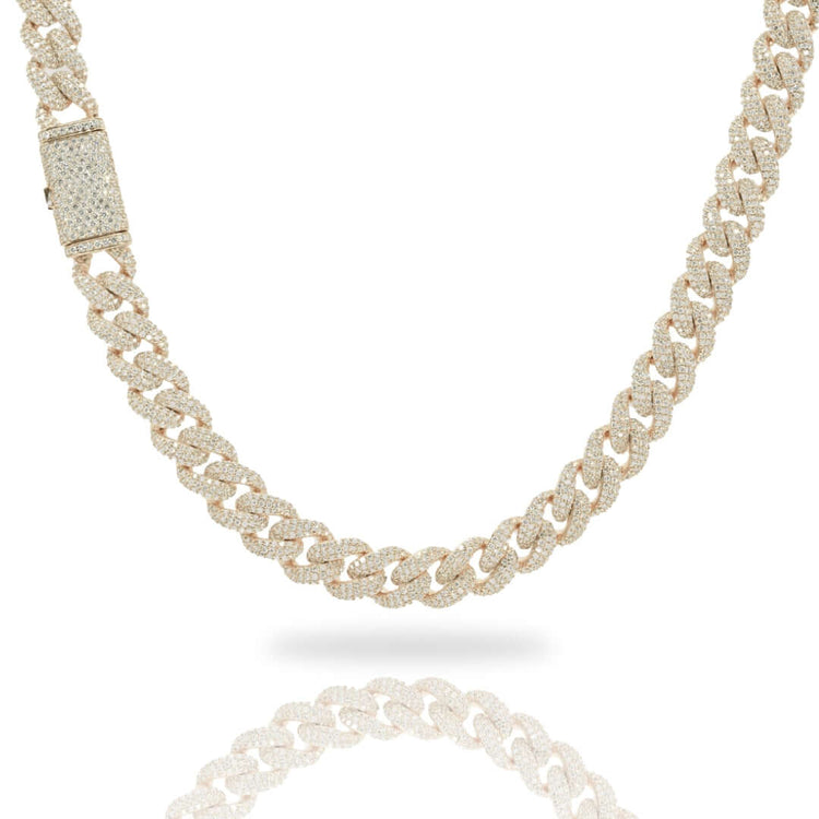 The Diamond Cuban Link Chain – 11mm, crafted in 10k solid gold and set with lab-grown diamonds, features a rectangular diamond-studded clasp and is shown against a white background with a subtle reflection below.