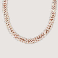 The Diamond Cuban Link Chain - 15mm is a rose gold necklace with an intricate zigzag pattern, encrusted with sparkling white stones and showcased against a plain light background.
