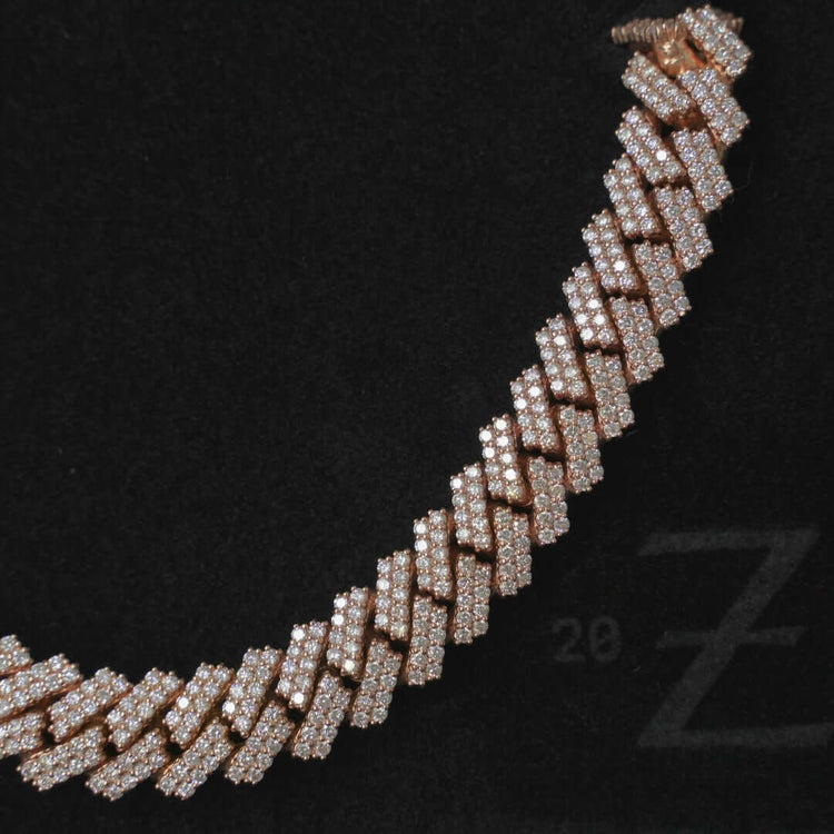 A close-up of the Diamond Cuban Link Chain - 15mm, featuring interlocking links encrusted with sparkling diamonds, displayed against a black background.