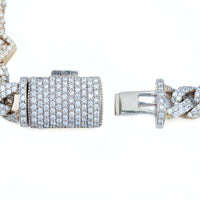 Close-up of the Diamond Heart Cuban Link Bracelet's 10k gold clasp, encrusted with multiple rows of sparkling diamonds, shown open with both ends visible against a white background.