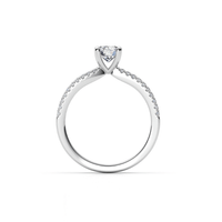 The Double-Band Lab Diamond Engagement Ring features a brilliant round lab diamond center in a prong setting, with white gold or platinum bands accented by lab diamonds along the upper half.