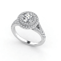 The Double Halo Round Cut Lab Diamond Engagement Ring in white gold features a round lab-grown center stone, split shank band, and sparkling accents—a timeless choice for women's engagements.