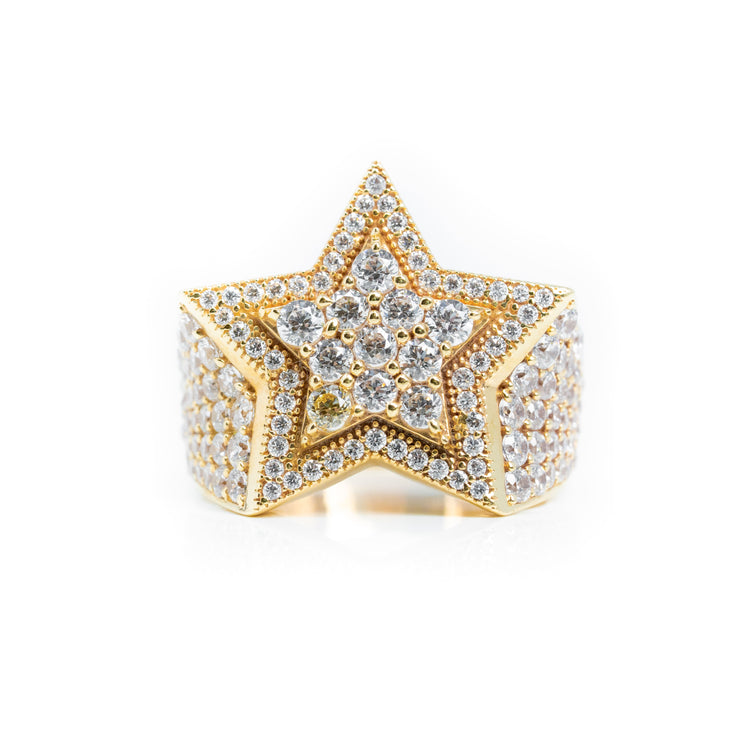 The Double Star Men Ring - 14k Solid Gold features a bold star design encrusted with sparkling clear diamonds, both outlined and filled, set against a white background for a striking men’s statement piece.