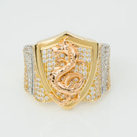 The Dragon Shield Ring - 10k Solid Gold features a shield-shaped face with a rose gold dragon set with diamonds and additional diamond accents on the band, offering bold style and striking detail.