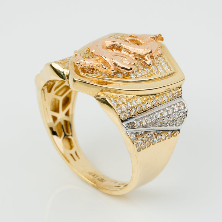 The Dragon Shield Ring - 10k Solid Gold showcases a raised rose gold dragon with diamond accents on the sides and top, set against a white background—an exquisite men’s ring for any collection.