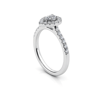 The Elegant Pear-Shaped Lab Diamond Halo Ring is a stunning women’s engagement ring in white gold, featuring a central pear-shaped lab diamond with a sparkling halo and lab diamonds along the upper band.