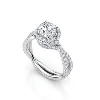 The Elegant Twisted Halo Lab Diamond Ring features a cushion-cut center lab diamond, a twisted white gold band, and sparkling accent diamonds in a dazzling halo setting.