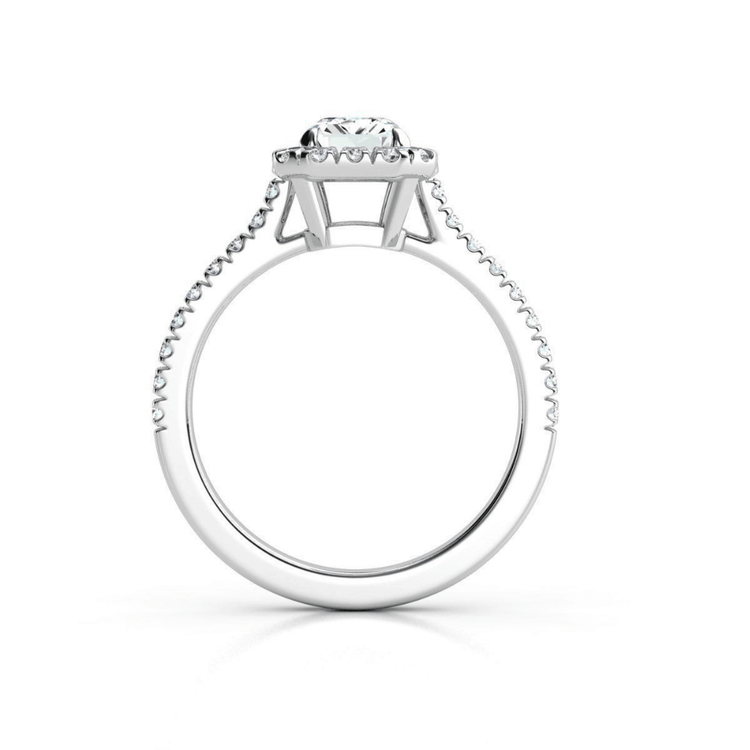 Side view of the Emerald-Cut Halo Lab Diamond Engagement Ring featuring a large emerald-cut center stone with prongs and sparkling lab diamonds set along the pavé band.
