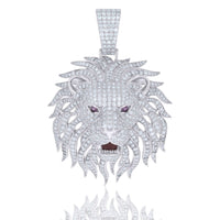 The Silver Moissanite Enameled Lion Head Charm Pendant features a white metal lion head with sparkling moissanite stones, purple gemstone eyes, an open mouth, and intricate enamel detailing.