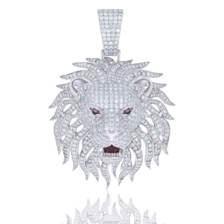 The Silver Moissanite Enameled Lion Head Charm Pendant features a white metal lion head with sparkling moissanite stones, purple gemstone eyes, an open mouth, and intricate enamel detailing.