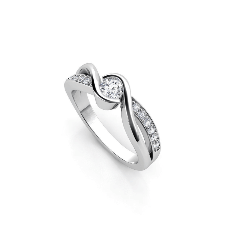 The Engagement Twist Ring - Lab Diamond is a silver ring with a central round lab-grown diamond, featuring a twisted band accented by smaller diamonds set along one side.