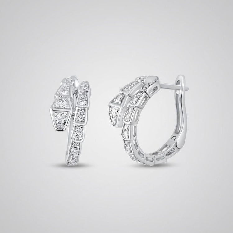 The 14k White Gold Snake Diamond Hoop Earrings 1/3CTW showcase geometric segments with sparkling natural diamonds, set in hoops displayed on a plain light gray background.