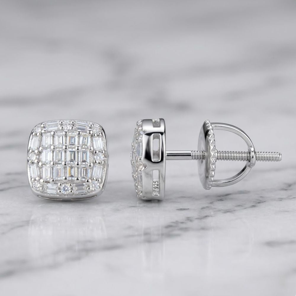 Sterling Silver Moissanite Square Stud Earrings featuring small rectangular and round clear stones in a grid pattern, shown on marble—one earring displays the front, the other shows the side and screw-back.