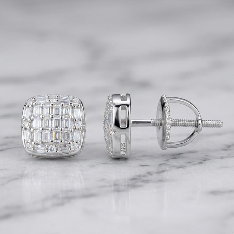 Sterling Silver Moissanite Square Stud Earrings featuring small rectangular and round clear stones in a grid pattern, shown on marble—one earring displays the front, the other shows the side and screw-back.