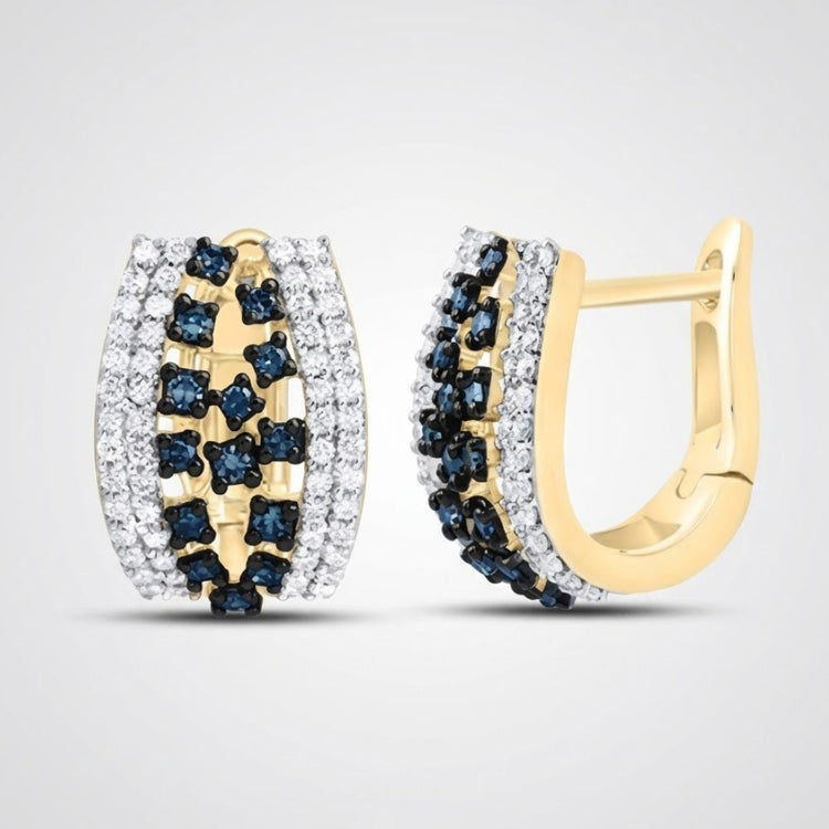 The 10k Yellow Gold Blue Diamond Hoop Earrings 1/2CTW showcase blue and white diamonds in a decorative pattern, adding elegance and sparkle to any look.
