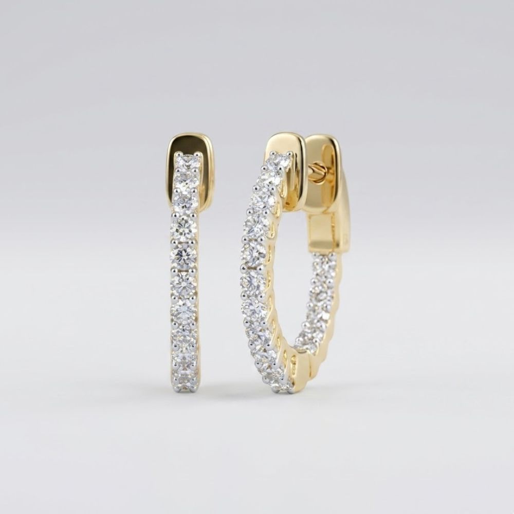 A pair of 14k Yellow Gold Diamond In Out Hoop Earrings (1 Cttw) shown against a plain light gray background.