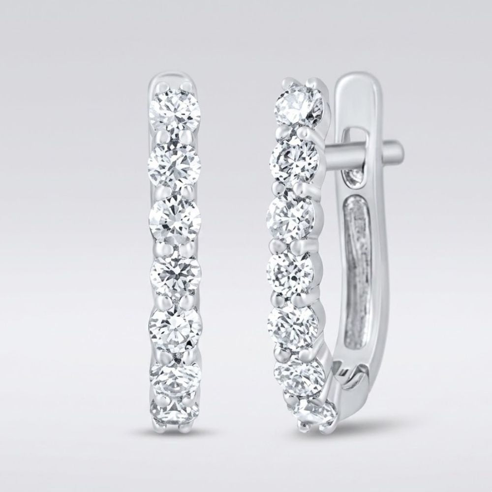 The 10k Gold Diamond Fashion Hoop Earrings 1/2CTW feature round white diamonds set in a row along the front outer edge, shown on a light gray background.