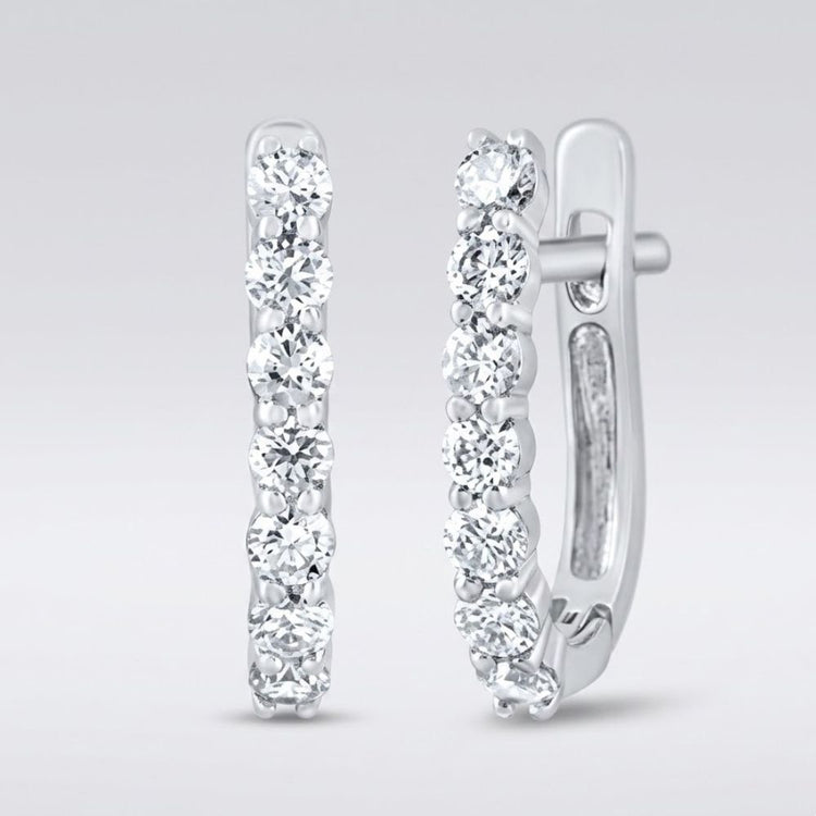 The 10k Gold Diamond Fashion Hoop Earrings 1/2CTW feature round white diamonds set in a row along the front outer edge, shown on a light gray background.