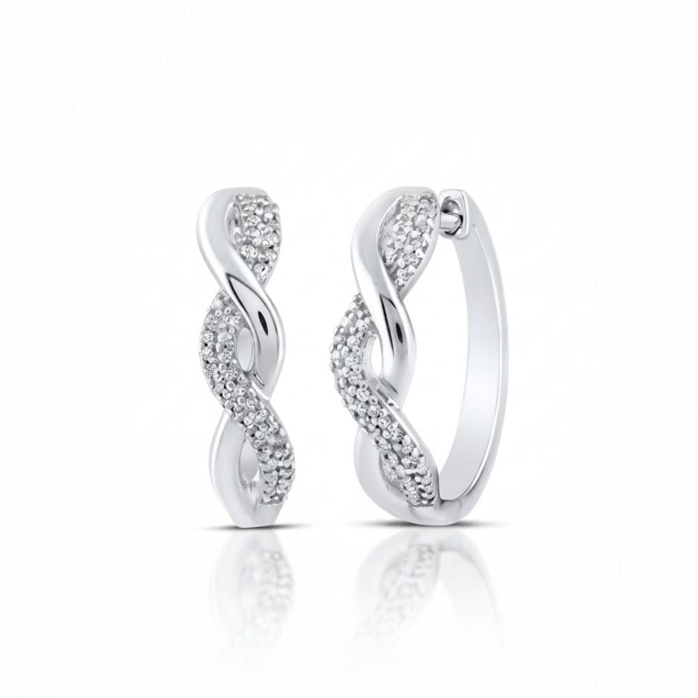 Sterling Silver Diamond Twist Hoop Earrings 1/10 Cttw feature an elegant twisted design with one side adorned in sparkling stones, shown on a white background with a subtle reflection.