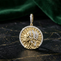 The 1/2CTW Natural Diamond Jesus Charm in 10K gold features a raised profile of Jesus with long hair, set against a radiant sunburst design—ideal as a men’s religious pendant.