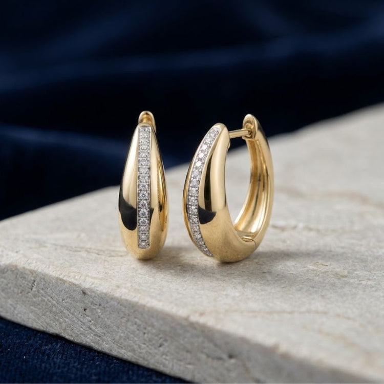14K Yellow Gold Natural Diamond Hoop Earrings in a thick, teardrop shape with a central inlay of small diamonds.