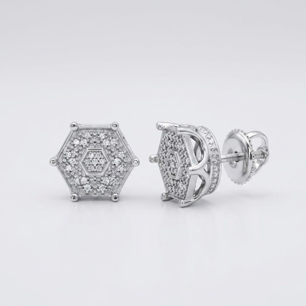 The 1/6CTW Diamond Hexagon Men’s Earring in sterling silver features multiple small natural diamonds in a cluster setting. One earring faces forward, while the other displays its side and screw-back closure.