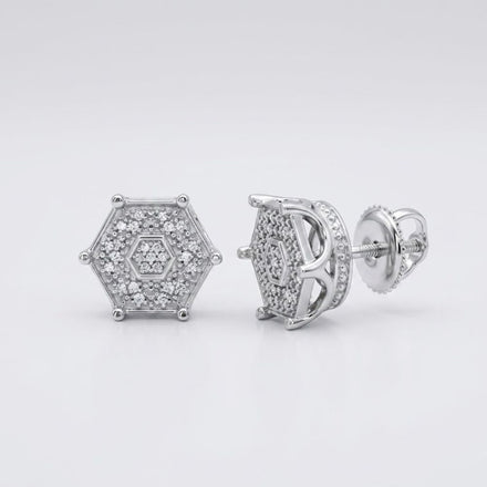 The 1/6CTW Diamond Hexagon Men’s Earring in sterling silver features multiple small natural diamonds in a cluster setting. One earring faces forward, while the other displays its side and screw-back closure.