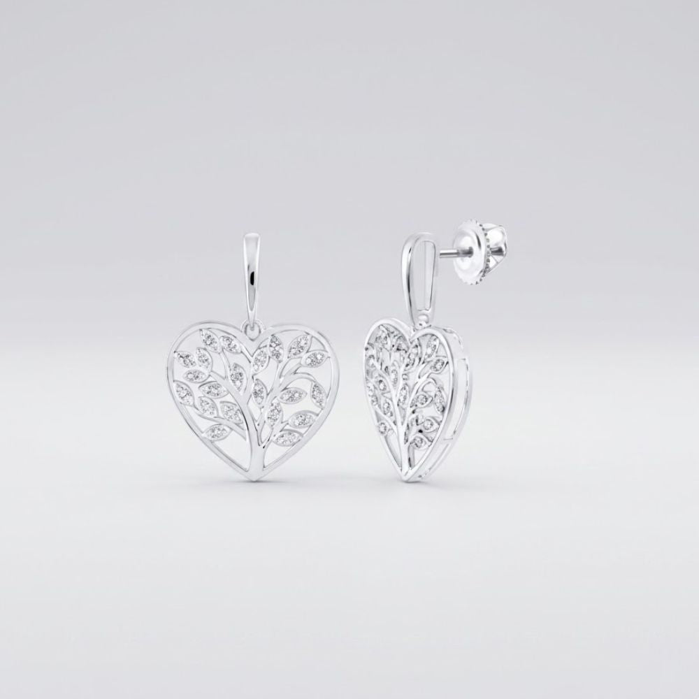 Sterling Silver Diamond Heart Dangle Earrings 1/10 Cttw featuring heart shapes, delicate leaf motifs, and sparkling diamond accents, shown against a light gray background.