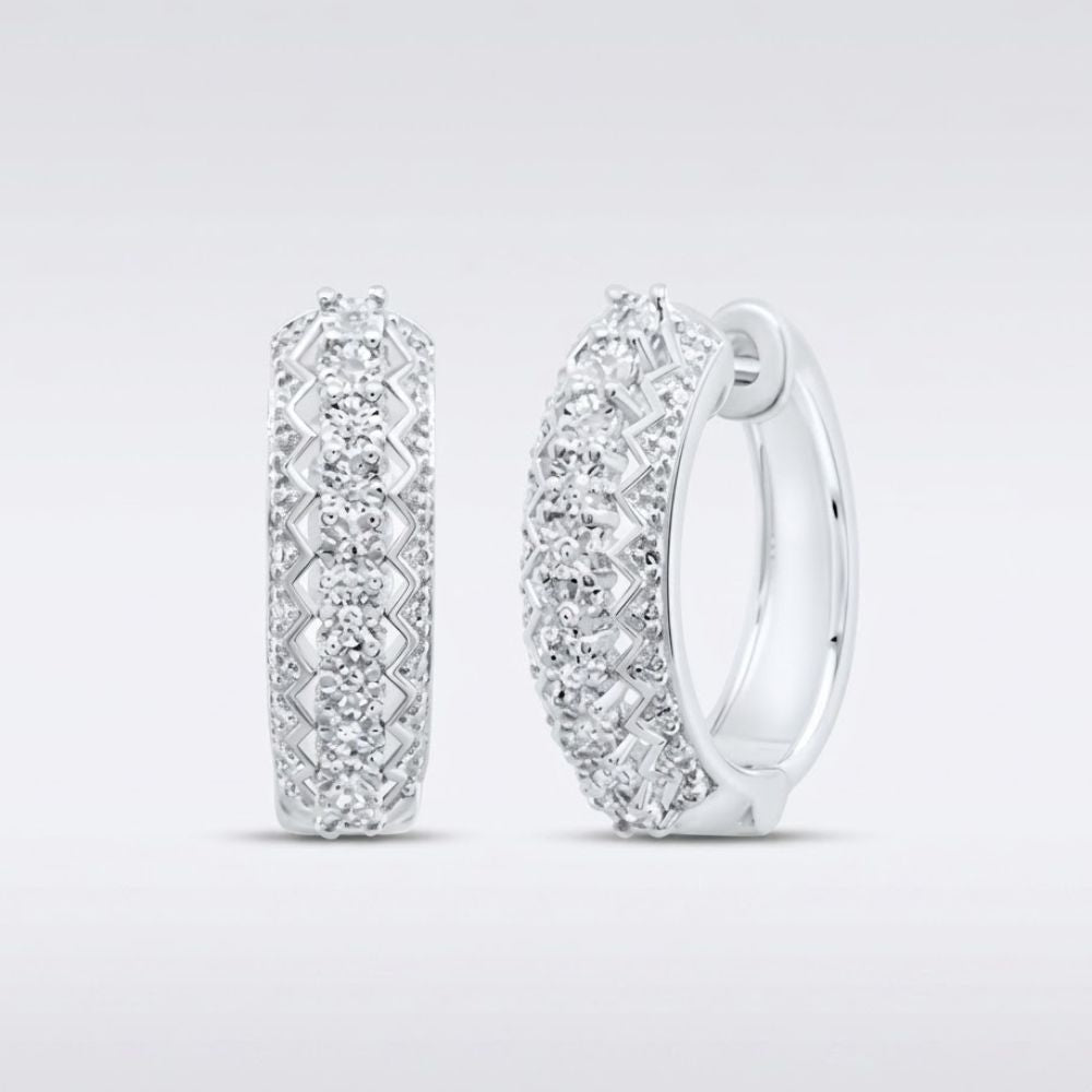 Sterling Silver Diamond Hoop Earrings 1/20CTW featuring intricate lattice designs and rows of sparkling diamonds, displayed on a light gray background.