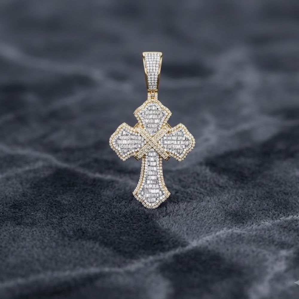 The 2-1/3CTW Diamond Cross Charm for men, crafted in 10K gold, features sparkling stones and intricate details, shown on a textured dark gray surface.