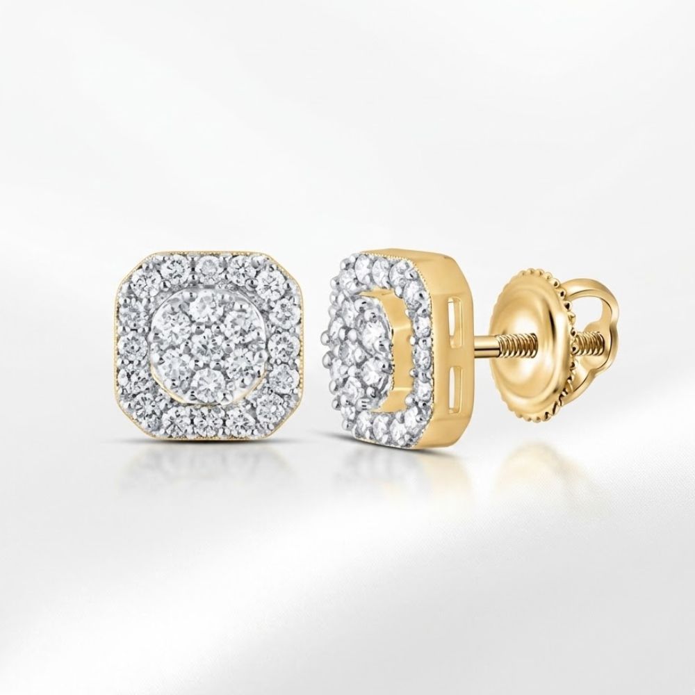 A pair of 1/2CTW octagon men’s diamond earrings in 10K yellow gold, each with sparkling natural diamonds set in geometric patterns and screw-back posts, displayed on a smooth, light surface.