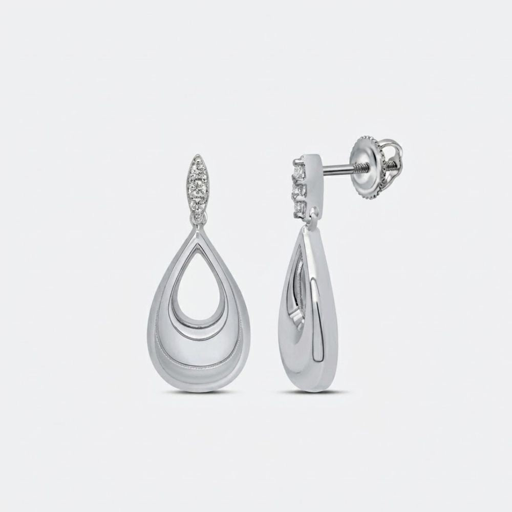 The 1/8CTW Diamond Pear Earrings in sterling silver feature a layered teardrop design with round diamond accents, polished finish, and secure screw-back closure—an elegant diamond gift.