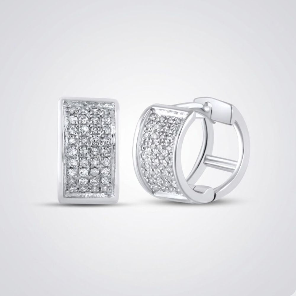 Sterling Silver Diamond Huggie Hoop Earrings 1/6 CTTW featuring a rectangular front with multiple sparkling diamonds, shown on a plain light grey background.