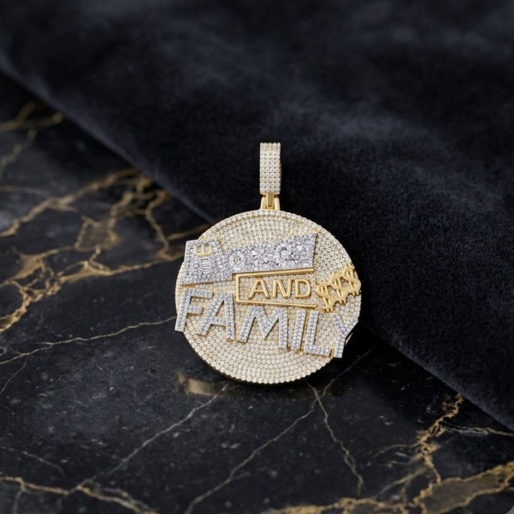 The 4-5/8CTW Diamond Money & Family Men’s Charm in 10K gold features a diamond-encrusted circular pendant with “PRICE AND FAMILY” in gold and silver letters, displayed on black marble—a true statement of luxury jewelry.