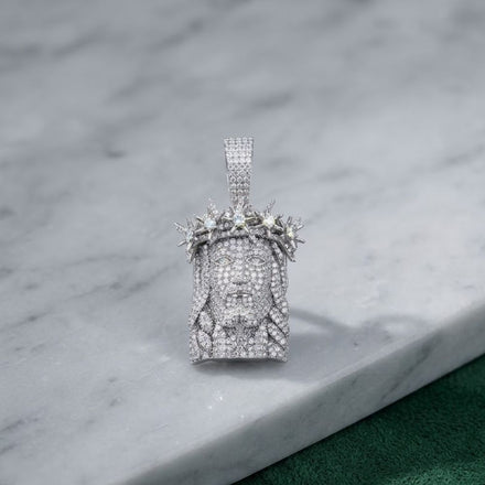 The 925 Silver Men Moissanite Jesus Pendant features a diamond-encrusted face with a crown of thorns, crafted in sterling silver—a bold statement piece of men's religious jewelry.