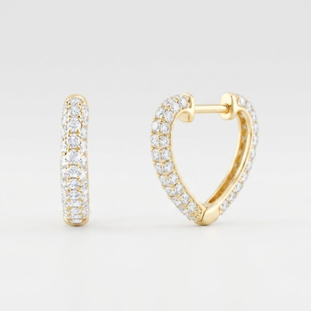 The 14k Yellow Gold Heart Diamond Hoop Earrings 1CTW are shown on a plain white background, featuring heart-shaped hoops crafted in 14k yellow gold and adorned with sparkling natural diamonds.