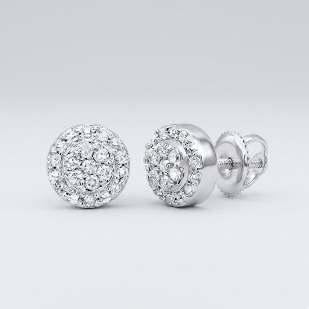 1/10CTW Diamond Round Earrings in sterling silver, featuring a double halo of sparkling diamonds, are displayed against a plain light gray background—an elegant gift choice.