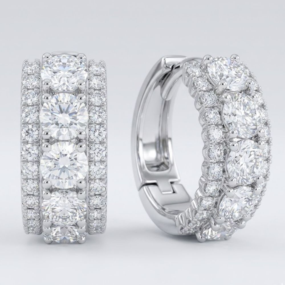 Elegant 14k white gold diamond 3-row huggie earrings (1 cttw) featuring rows of sparkling round-cut diamonds, displayed on a light gray background.