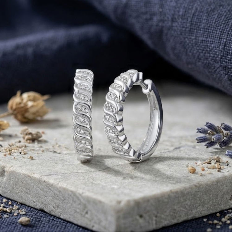 Sterling Silver Diamond Hoop Earrings 1/6 CTTW in a textured, spiraled design featuring small inlaid diamonds.