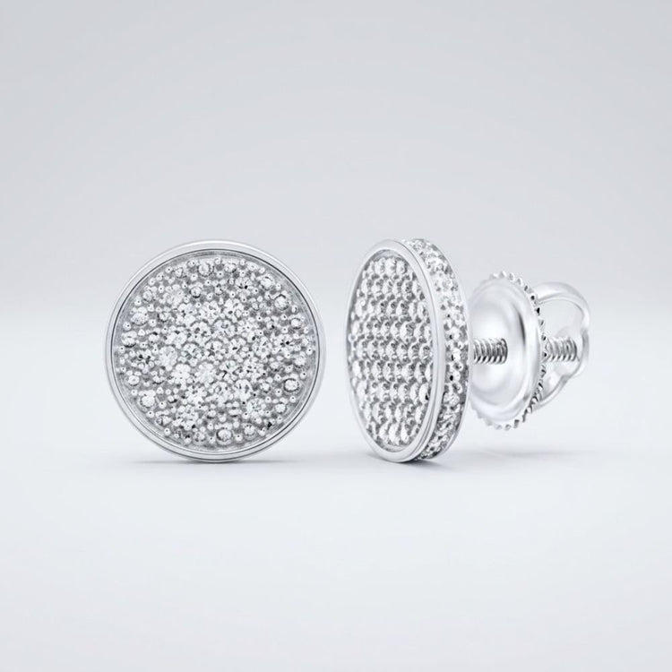 A pair of 1/4CTW natural diamond men's sterling silver earrings with pave-set sparkling white stones, displayed on a plain light gray background. One earring shows the front; the other reveals the side and screw-back closure.