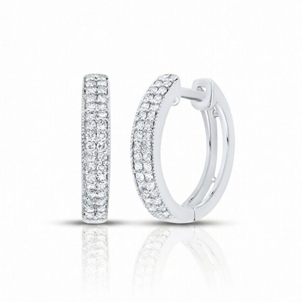 1/4CTW Natural Diamond Hoop Earrings in 14k white gold, featuring rows of natural diamonds, are shown on a white background with a subtle reflection underneath.
