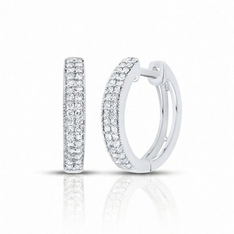 1/4CTW Natural Diamond Hoop Earrings in 14k white gold, featuring rows of natural diamonds, are shown on a white background with a subtle reflection underneath.