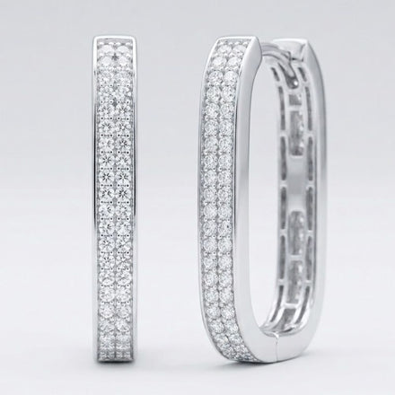 The 14k White Gold Diamond Hoop Earrings 3/8CTW feature three rows of sparkling natural diamonds in a rectangular design, displayed upright on a plain light gray background—a stunning piece of fine jewelry.