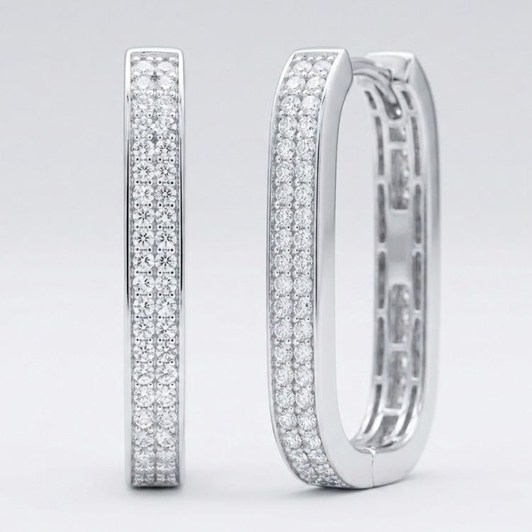 The 14k White Gold Diamond Hoop Earrings 3/8CTW feature three rows of sparkling natural diamonds in a rectangular design, displayed upright on a plain light gray background—a stunning piece of fine jewelry.