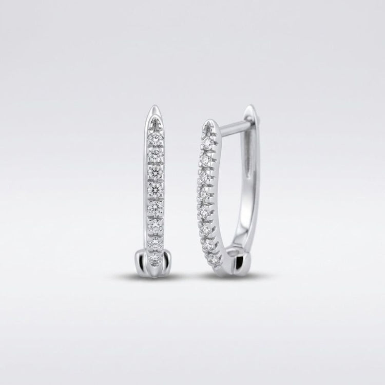 A pair of 10k Gold Round Diamond Hoop Earrings (1/12 Cttw) with slim silver hoops and sparkling diamonds along the front, shown on a plain light gray background.