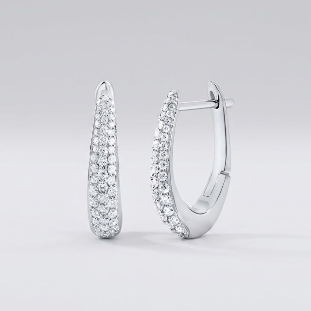 A pair of 14k White Gold Diamond Hoop Earrings 1/2CTW Fashion is shown against a plain, light background, featuring elegant hoops encrusted with small sparkling diamonds.
